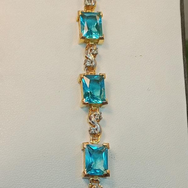 Blue Topaz and Diamond Gold Bracelet